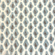 Bastideaux Fiesole Stone Blue textile with blue organic motifs and brown leaf details on a cream ground