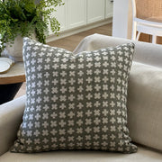 Bastideaux Bogo pillow in soft olive green with ivory geometric cross motifs