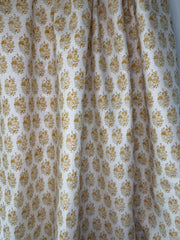 A close-up image of a fabric with a floral pattern, featuring a bouquet of roses and peonies in a 19th-century Meiji style.