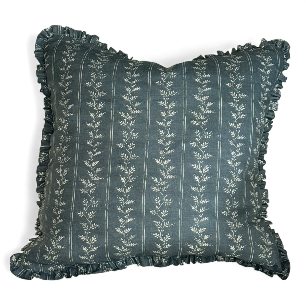 Decorative pillow in Florence Faroe blue with floral pattern and ruffled edges on a white background
