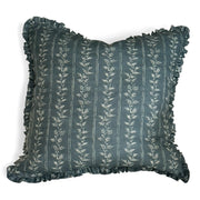 Decorative pillow in Florence Faroe blue with floral pattern and ruffled edges on a white background