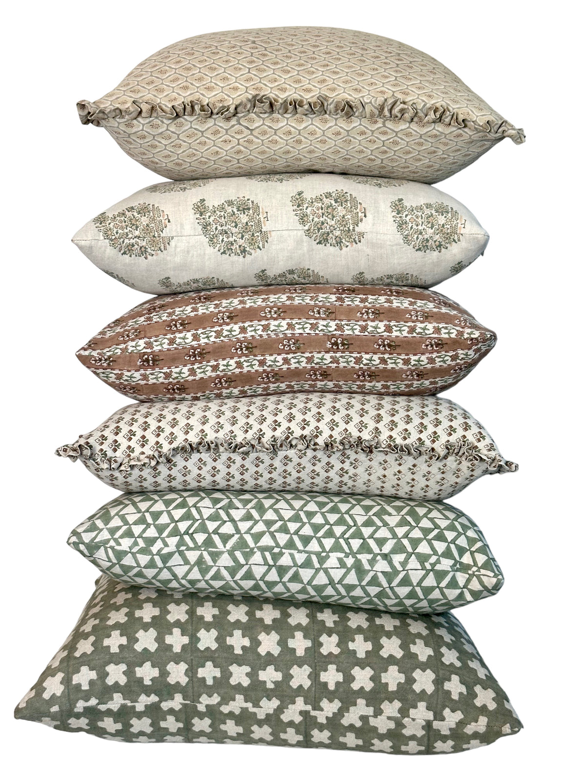 Stack of Bastideaux decorative pillows in layered green, brown and neutral patterned textiles