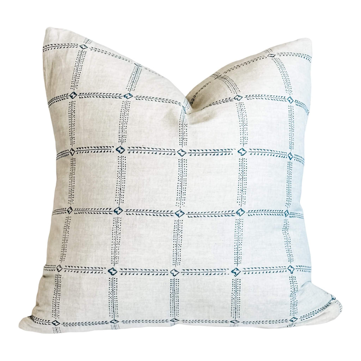 A square-shaped pillow with a marine blue and white geometric patterned fabric.
